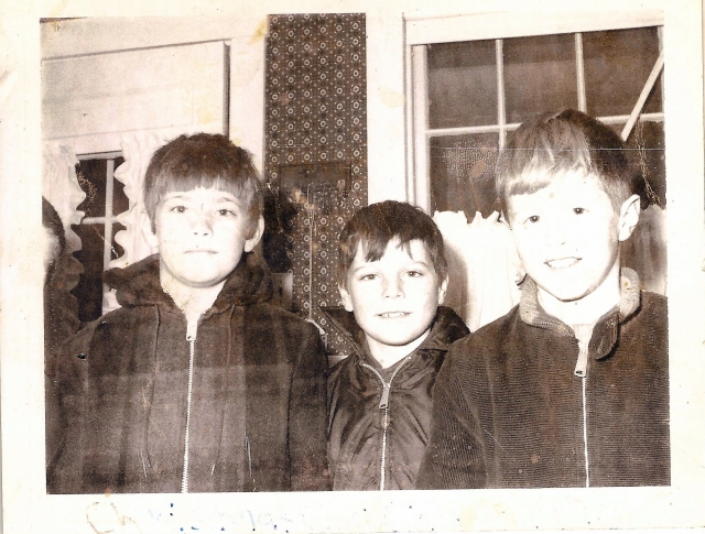 1970, Xmas Caroling at the Despres house. L-R: Brian Kempton (edge of face peeking in), Steve Johnson, Don Montgomery, David McIntosh